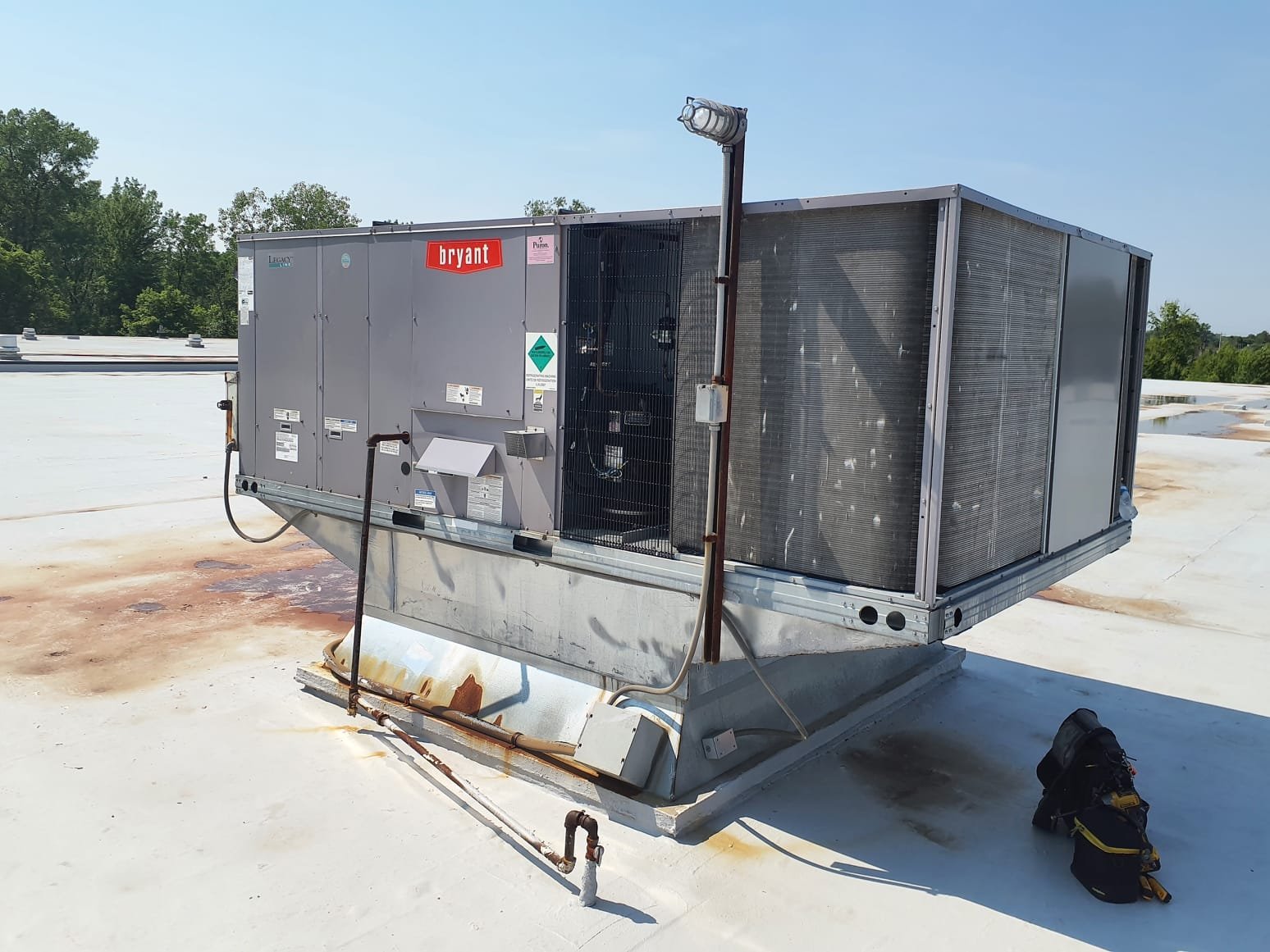 Diagnostic inspection on two rooftop systems. First system tested was #5. Inspection of unit showed no issues at this time. Air temperatures, and refrigerant temperatures were measures within spec. Did not witness any icing while testing. Second system tested was #2. System ran in cooling with a high air temperature drop of ~27F. Attempted to adjust motor pulley to increase airflow. Adjusted pulley as far as possible with not much change due to pulley being difficult to adjust due to age and rust. Current temperature drop with pulley adjusted as far as possible is 23-25F. Pulley should be replaced along with a new A61 belt. New pulley will be able to be adjusted further. Pulley size 4 3/4in with 7/8in shaft. May need a proper pulley puller to remove old pulley. Air filters are mostly dirty and should be replaced to help with proper airflow. Both systems are running in cooling at this time.  Diagnostic inspection on two rooftop systems. First system tested was #5. Inspection of unit showed no issues at this time. Air temperatures, and refrigerant temperatures were measures within spec. Did not witness any icing while testing. Second system tested was #2. System ran in cooling with a high air temperature drop of ~27F. Attempted to adjust motor pulley to increase airflow. Adjusted pulley as far as possible with not much change due to pulley being difficult to adjust due to age and rust. Current temperature drop with pulley adjusted as far as possible is 23-25F. Pulley should be replaced along with a new A61 belt. New pulley will be able to be adjusted further. Pulley size 4 3/4in with 7/8in shaft. May need a proper pulley puller to remove old pulley. Air filters are mostly dirty and should be replaced to help with proper airflow. Both systems are running in cooling at this time.