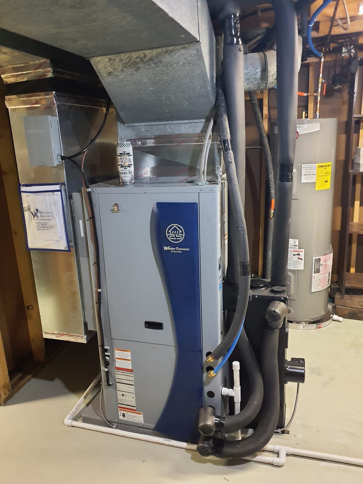 Install Water Furnace 5 Series Geothermal system. 2 Stage compressor, Variable Speed ECM blower
Model #: W5AV036BD1A12CTL2B00
Serial #: 250701150
Left Side Return
3 Ton Package
Efficiency: Up to 5.0 COP / 30.0 EER
Features Included:
*Aurora Advanced Controls
*15KW Backup heat
*2" Merv 11 air filter
*Geo Link 1 pump non-pressurized loop flow center
*Vision Pro 8000 WiFi thermostat

Installation:
*Install 3 Ton vertical closed ground loop. Installed By Jackson Geothermal.
*Reconnect to existing high voltage electrical circuit
*Transition to existing supply and return duct
*Add 1 return air to basement

Warranty: (Annual maintenance must be performed)
Water Furnace 10 Year Parts
Water Furnace 10 Year Labor
Flow Center and Accessories 5 Year Parts and Labor

Optional accessories:
NuCalgon iWave Air Purifier - ADD $925 [Declined}
Reusable/Washable Electrostatic Air Filter - ADD $175 [Declined]

*** 30% Federal Tax Credit Eligible

Disclaimer:
No drill cuttings or water cleanup is included i