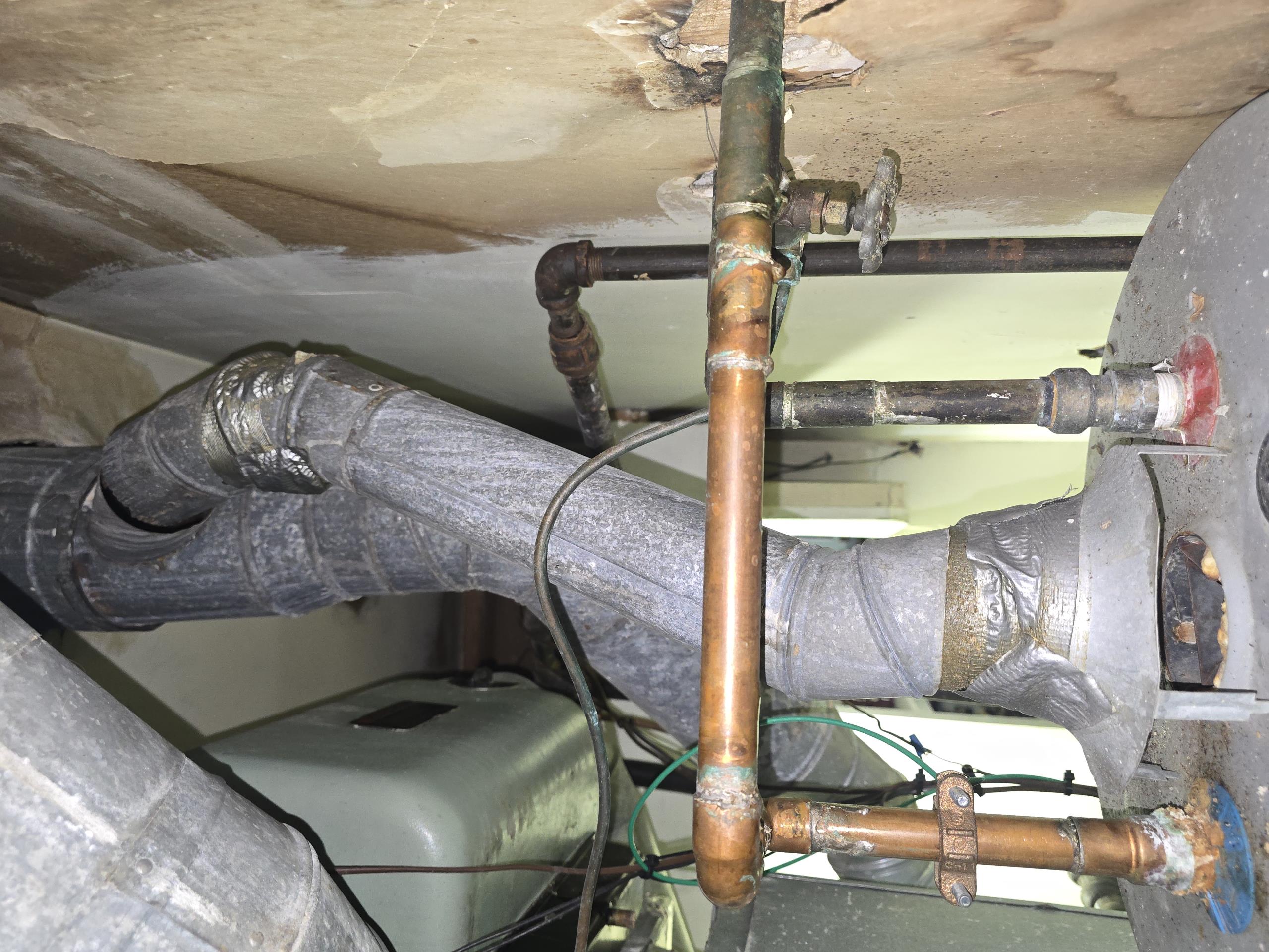 Replace two elbow fittings and approximately one foot of pipe. New 26 gauge pipe and elbows used for replacement. Three screws n each fitting to ensure nothing comes apart in the future. Light water heater and set slightly lower than previous setting per Ron's request. Water heater vent is good and safe for use. 