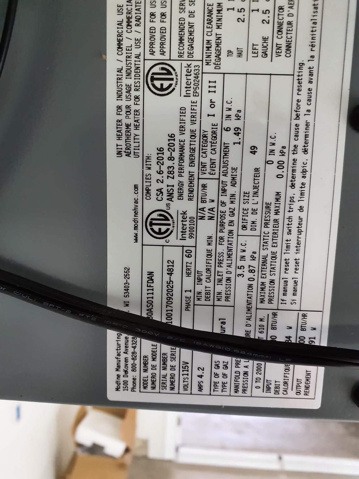Install customer provided unit heater.