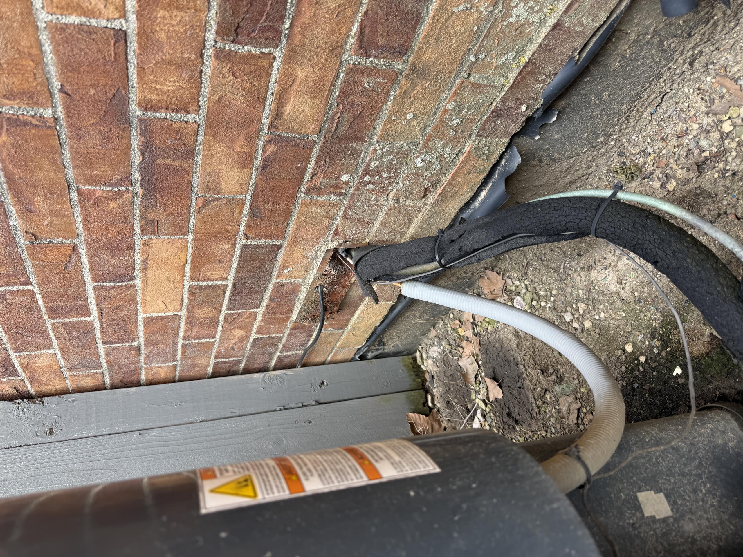 R22 system.  Low on refrigerant.  Blower and indoor coil are also plugged with dirt due to no proper filter rack.  Filter sitting inside the blower cabinet is not sufficient to keep the system clean.
Furnace is also old and in very poor shape.
Outdoor unit high voltage does not have a service disconnect.