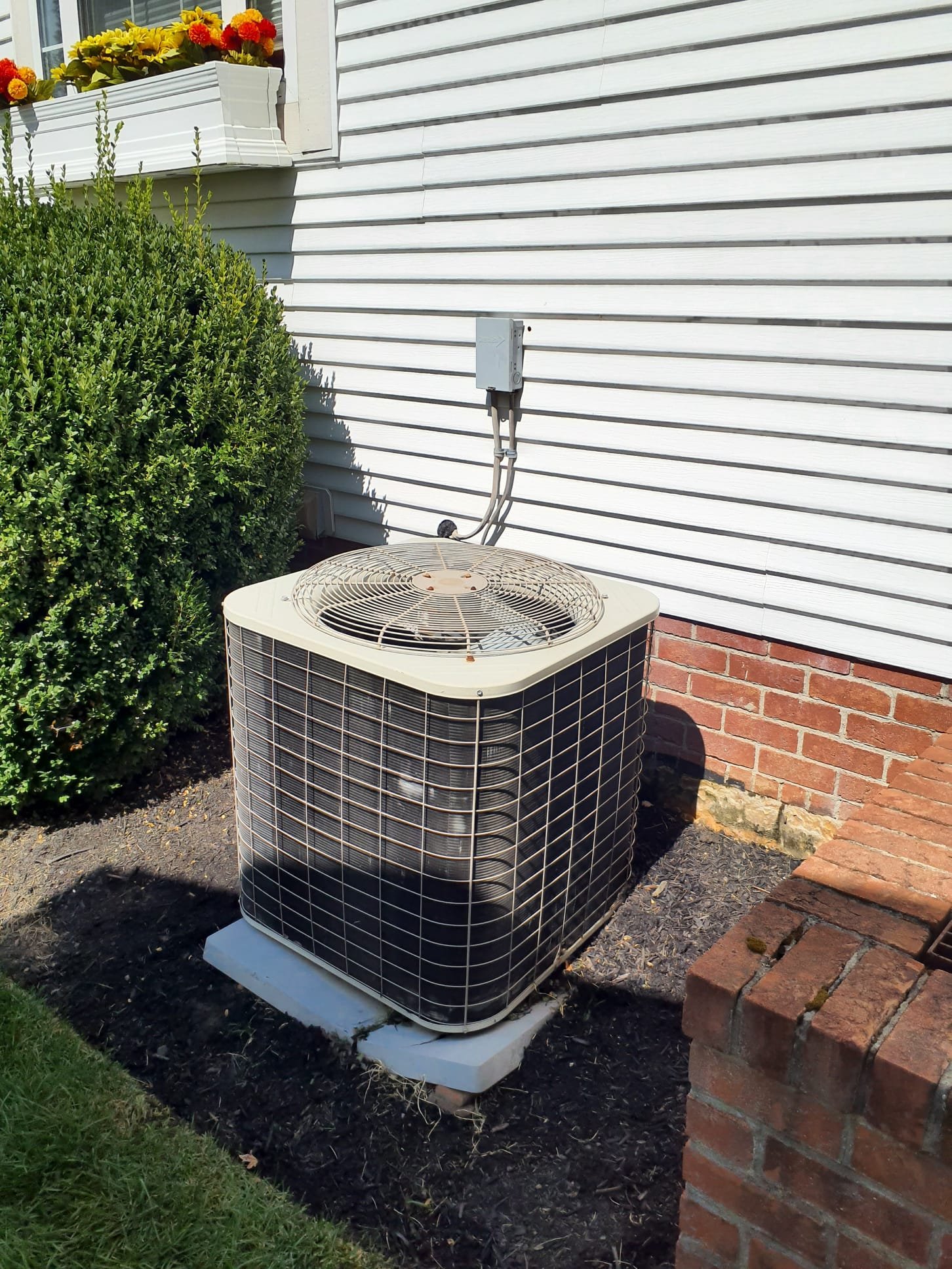 2003 Bryant R-22 AC system was operating in cooling mode upon arrival. Indoor blower is operating and thermostat is operating. Inspection of outdoor unit showed that compressor is running but condenser fan motor is not. Compressor was making louder than usual noise while running. Entire system was very hot to the touch. Service disconnect was very hot aswell. Pulled disconnect and used garden hose to cool system down to safe temperatures. Once cooled down, inspection of electrical components showed that 55/5UF capacitor is reading 12/0uf. This explains why the compressor was running, and creating excess heat, and why the condenser fan motor was not operating. Replaced with new 55/5uf capacitor setup and test run operation. Compressor and fan motor come on as they should. Compressor is no longer making unusual noises. Refrigerant lines carry a normal temperature. Did not check refrigerant pressures as there are no issues suspected. System is operating in cooling at this time. Due to age