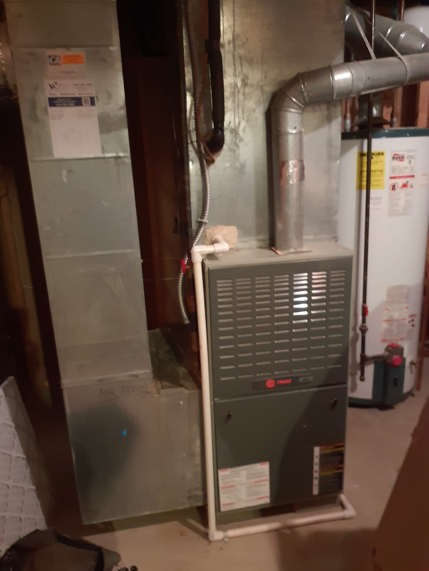 Performed two system heating maintenance 

Attic furnace:
2003 Trane single stage 80% efficient furnace 
Replaced 20x25x4 filter
Pulled and cleaned flame sensor 
Cleared pressure switch port
Blower wheel and motor in OK condition 
Blower capacitor in spec 
Gas pressure 3.5"wc
Temperature rise within specification range 
No signs of condensate drain issues related to air conditioning season
No concerns found with this furnace

Basement furnace 
2003 Trane single stage 80% efficient furnace
20x25x1 Filter is new
Pulled and cleaned flame sensor
Cleared pressure switch port
Blower wheel is a little dirty, but not to the point of causing an issue with operation
Blower capacitor is in spec
Gas pressure 3.5"wc
Temperature rise within specification range
No signs of water leaks from cooling season
No concerns found with this Furnace

Both furnaces are operating within factory specifications at this time 