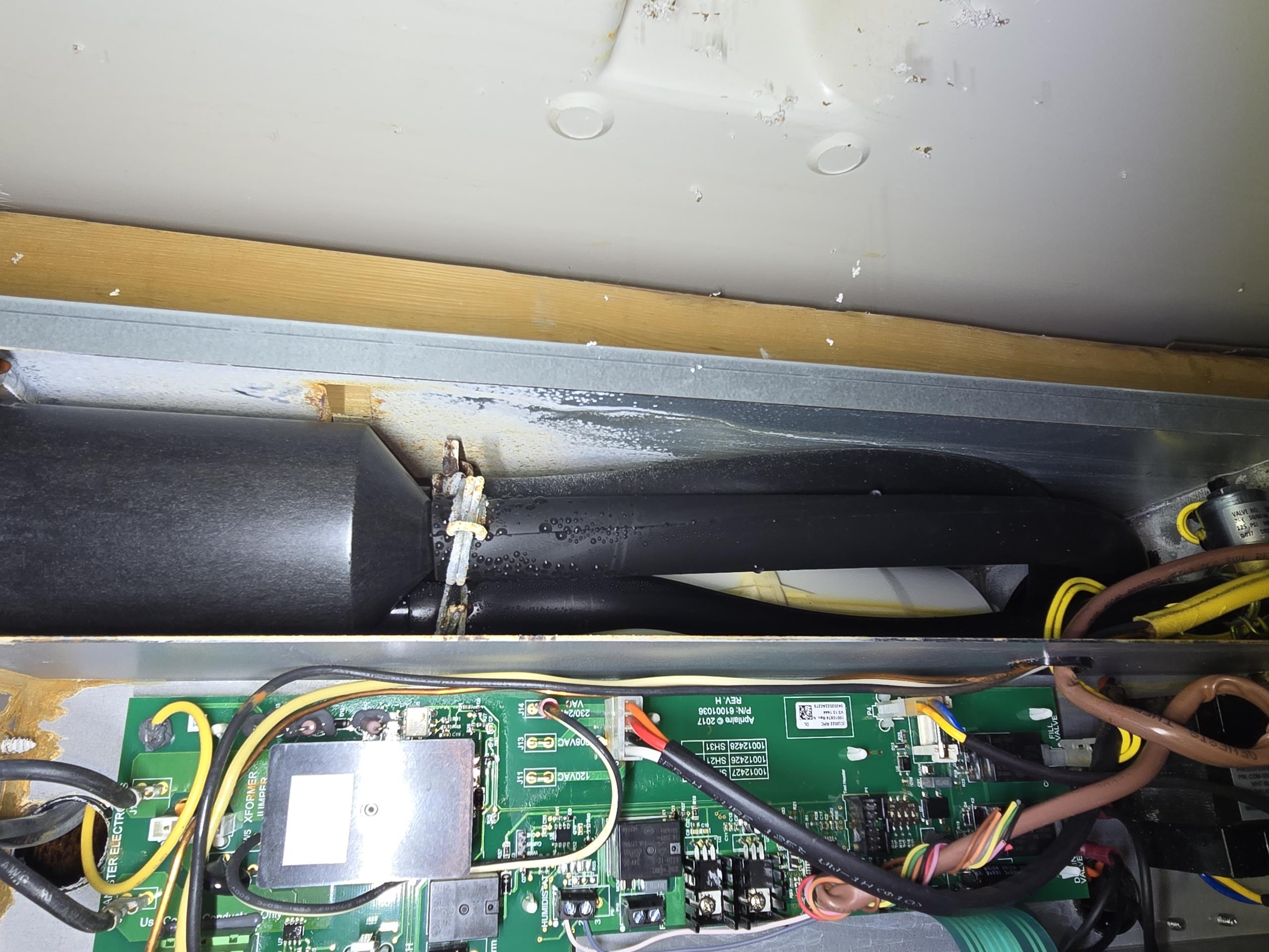 Unable to pinpoint leak so water is turned off go humidifier. Inspection of humidifier shows that the humidifier is in very poor condition. It appears that one of the high voltage leads has burnt off and damaged other parts of the humidifier including internal waterlines, and metal housing. Will need to talk with office and Aprilaire about repairs or replacement possibility. Photos uploaded to file to assist with further research. 