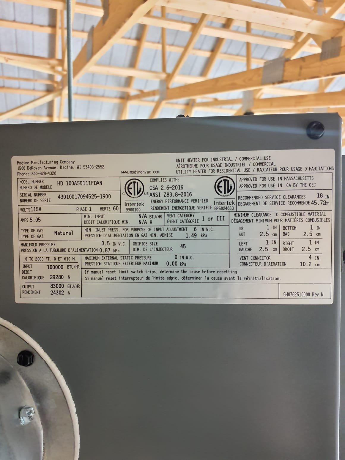 
Install hanging gas unit heater and vent through exterior wall or roof.