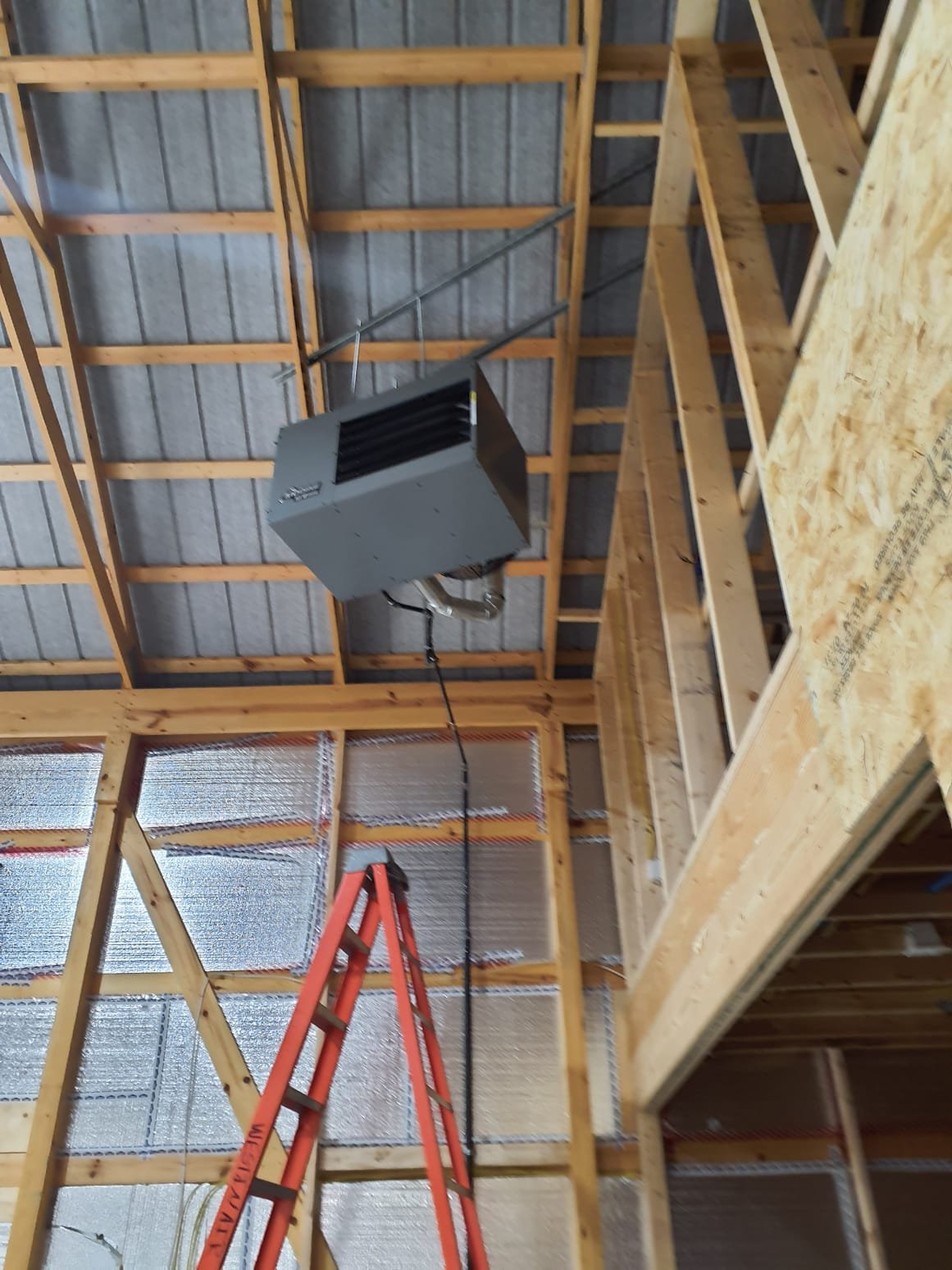 
Install hanging gas unit heater and vent through exterior wall or roof.
