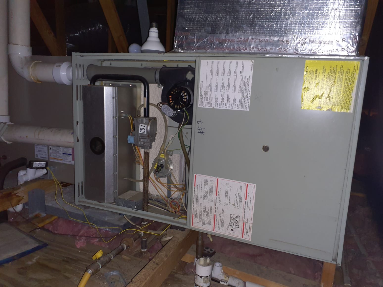 Need 8' ladder 
Furnace #2 (first furnace inside the attic)
Rollout switch tripped
Reset, furnace ran for a few minutes then shot flames out the front
Furnace has been running OK since
All Furnaces are from 1995
Every single system is in various states of disarray and are 30 years old
All but one furnace in the attic had tripped rollout switches. 
Rollout safeties tripped usually indicates bad heat exchangers
All 4 attic furnaces are installed improperly: venting and drainage installed incorrectly 
The two basement systems have been scabbed for parts or are partially disassembled 
We do not recommend repairs due to age and condition.