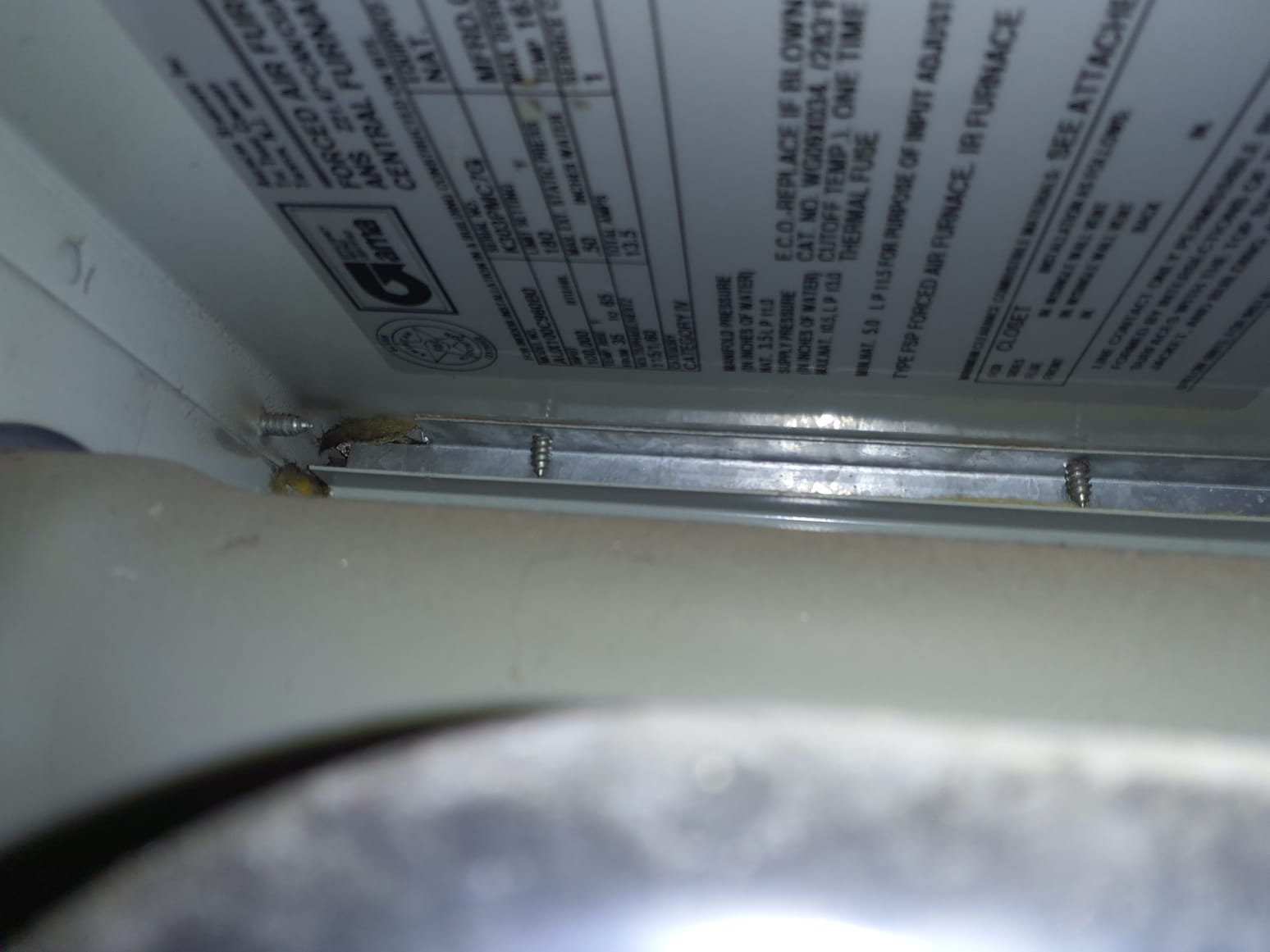 Need 8' ladder 
Furnace #2 (first furnace inside the attic)
Rollout switch tripped
Reset, furnace ran for a few minutes then shot flames out the front
Furnace has been running OK since
All Furnaces are from 1995
Every single system is in various states of disarray and are 30 years old
All but one furnace in the attic had tripped rollout switches. 
Rollout safeties tripped usually indicates bad heat exchangers
All 4 attic furnaces are installed improperly: venting and drainage installed incorrectly 
The two basement systems have been scabbed for parts or are partially disassembled 
We do not recommend repairs due to age and condition.