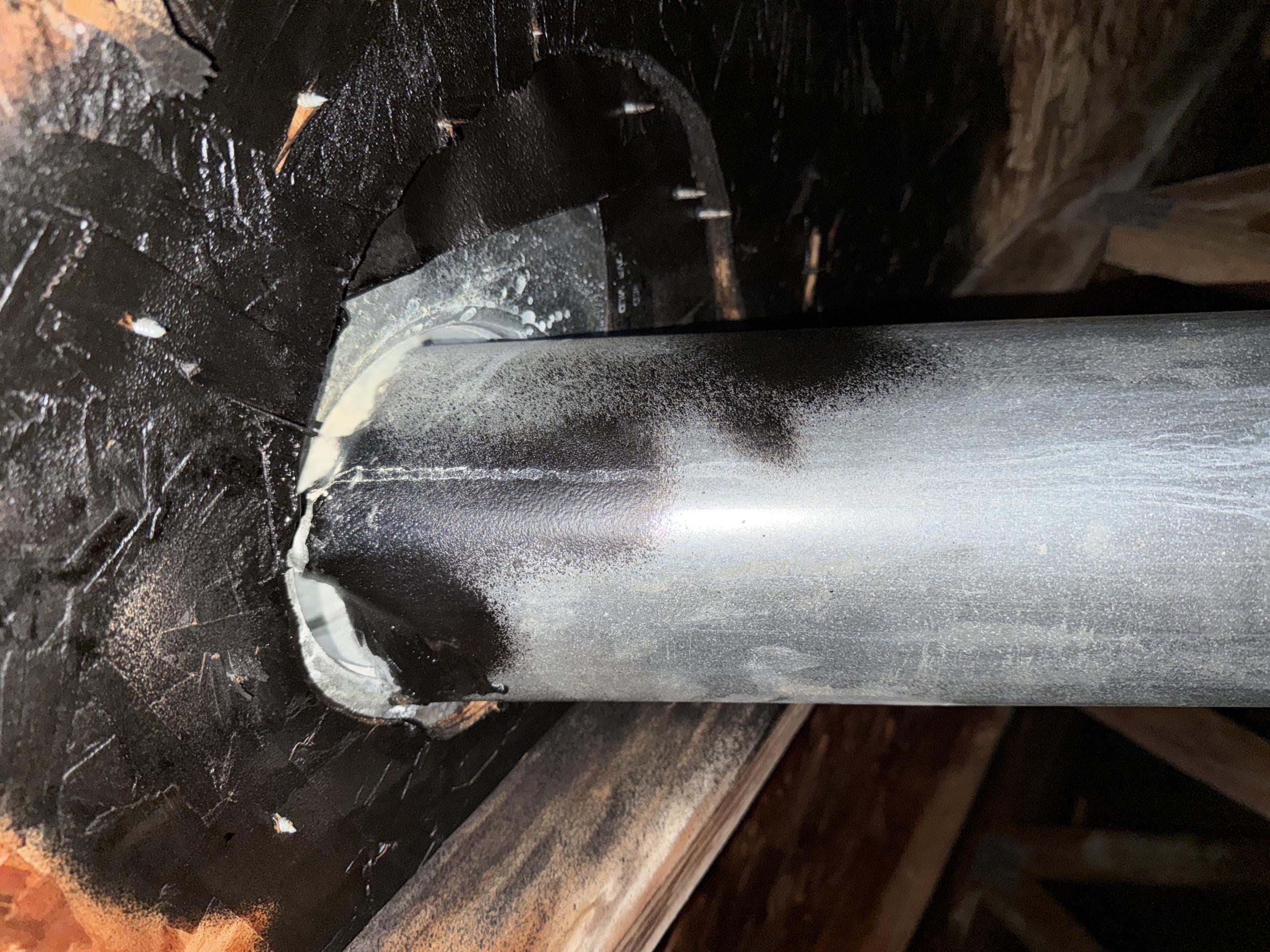 5" B vent is short at the roof sheeting
Need to replace top section of B vent and terminate properly.

Tested for carbon monoxide
Got 0ppm in the house and only CO readings were 10ppm at the very top of the flue where it is short at the roof sheeting. 

6' ladder to get in the attic