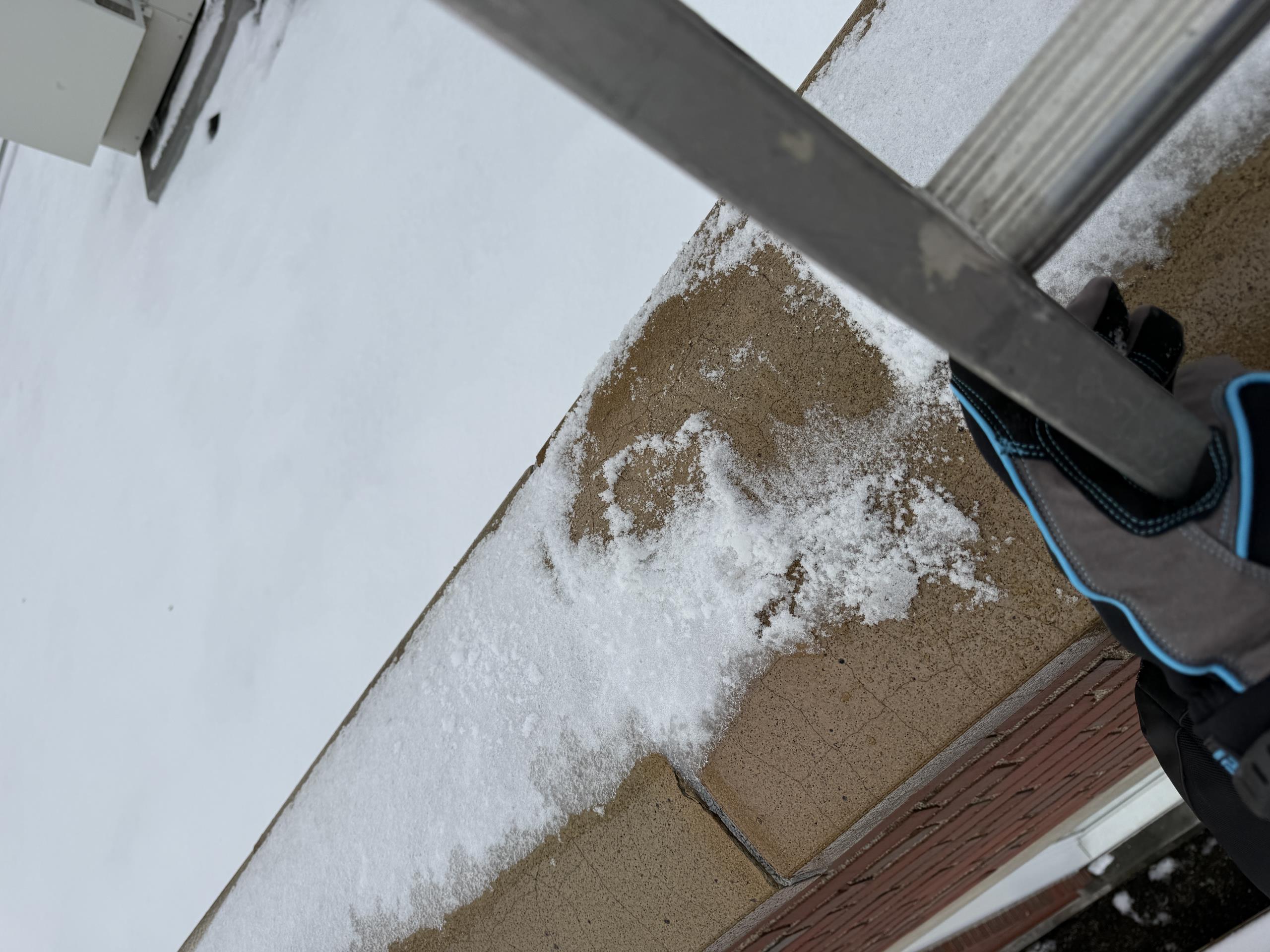 Mini split outdoor unit laying on its back.
I could have blown over from wind or it could have been vandalized. 
Ice on the edge of the roof line makes getting up impossible today
We will need to return after it thaws and assess the damage to the unit
Best case it just needs stood up, allow the Compressor oil to settle back to the bottom for 24hrs and see if it runs
Worst case, the Compressor has failed as a result of laying on its back  and trying to run.  **this will require unit replacement**