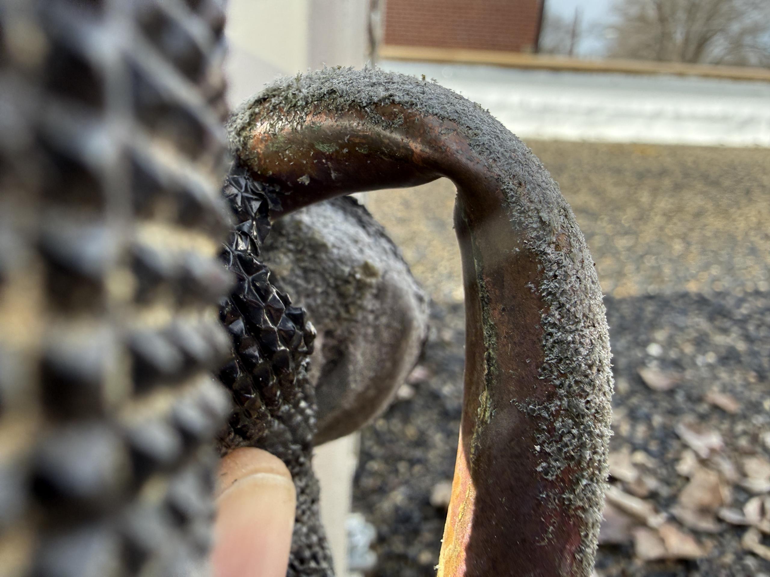 Stood unit back up.  Compressor will not start.  Line set also kinked, so even if the Compressor did run, we'd need to do a few hours worth of work to it.

We are exploring all avenues, possibly replace compressor under warranty.  
Otherwise, we will quote a new Daikin mini split system equivalent to the Mitsubishi hyper heat that's there now. 