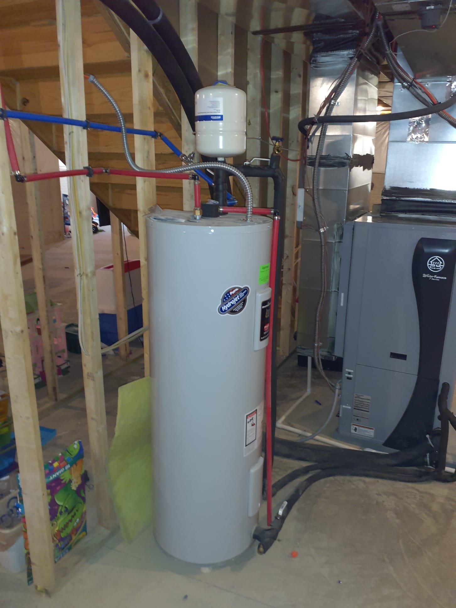 Upon arrival, system is locked out on E71-Loss of Charge code. Used aid tool to check refrigerant pressures. System is stagnant with 180psi refrigerant system. Performed power reset to clear lockout. Performed operational test in both heating and cooling modes and cross referenced to installers manual to know whether pressure, and temperatures are within spec. Performed heating test first. After 15 minutes of run time, refrigerant pressures and temperatures are within specifications. Ground loop temperature drop is within spec. Air temperature rise is within spec. No issues with the operation of the unit were found. 
Found that hot water generator lines are swapped based on Waterfurnace installation manual. 
Disconnect and reconnect hot water generator lines to correct DHW IN and DHW OUT connections. 
