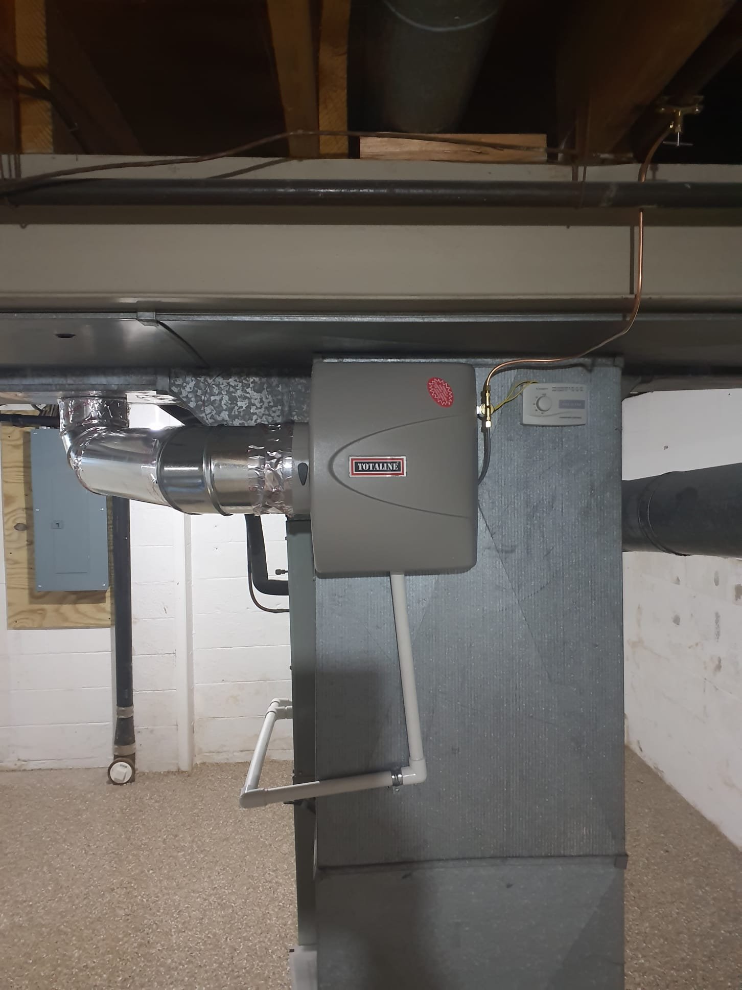 Install humidifier on hvac system. 

Install humidifier on return duct with bypass piped to supply. Water line installed with new water valve on hot water line. Drain ran to drain pump. Wired into duct mounted controller with 24v xfmr powered from EAC terminal. If humidiy has a hard time keeping up with heat only, turn thermostat fan option to ON. test run all humidifier components and drain pump.