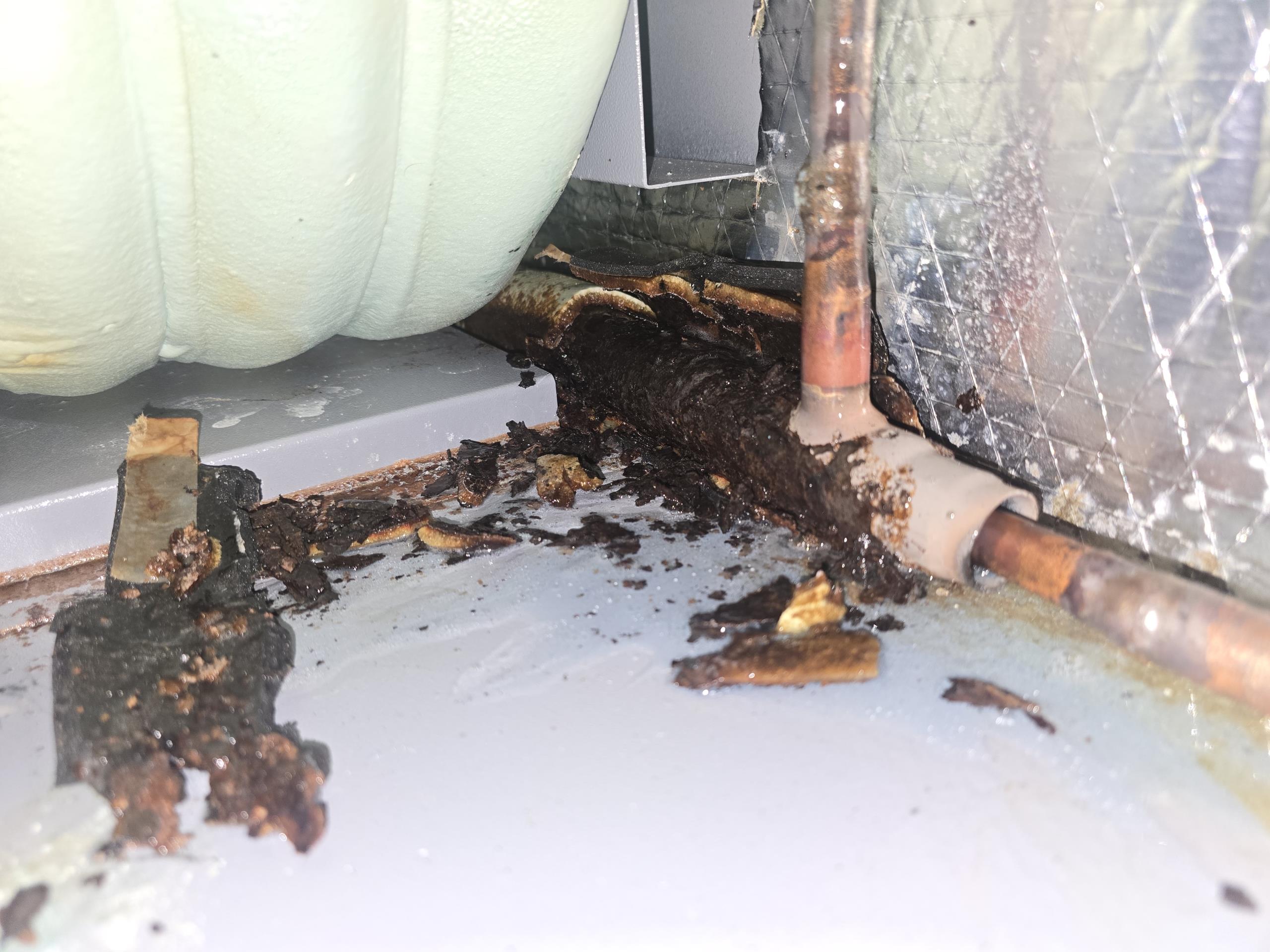 Upon arrival, system is locked out on low pressure code. Unit fault history has a number of low pressure and fp1 sensor error codes indicating low refrigerant charge. Tested refrigerant pressure and found 0.7psi in the system. The system has had a major blowout. Perform leak search in attempt to find refrigerant leak on Waterfurnace 5 Series package system. Could not pinpoint leak but was able to isolate the leak to somewhere in the outer wall of the domestic hot water generator coil. Visible oil on and around the area hinted to the location. Infrared sniffer was picking it traces of refrigerant from the area but could not pinpoint with leak detector gel. Hot water generator coil, aka desuperheater coil, will need replaced. Called Waterfurnace for warranty status and availability. Part is covered under warranty, but labor and refrigerant are not. Prepared quote for replacement. System can currently be ran in emergency heating mode for heat. 