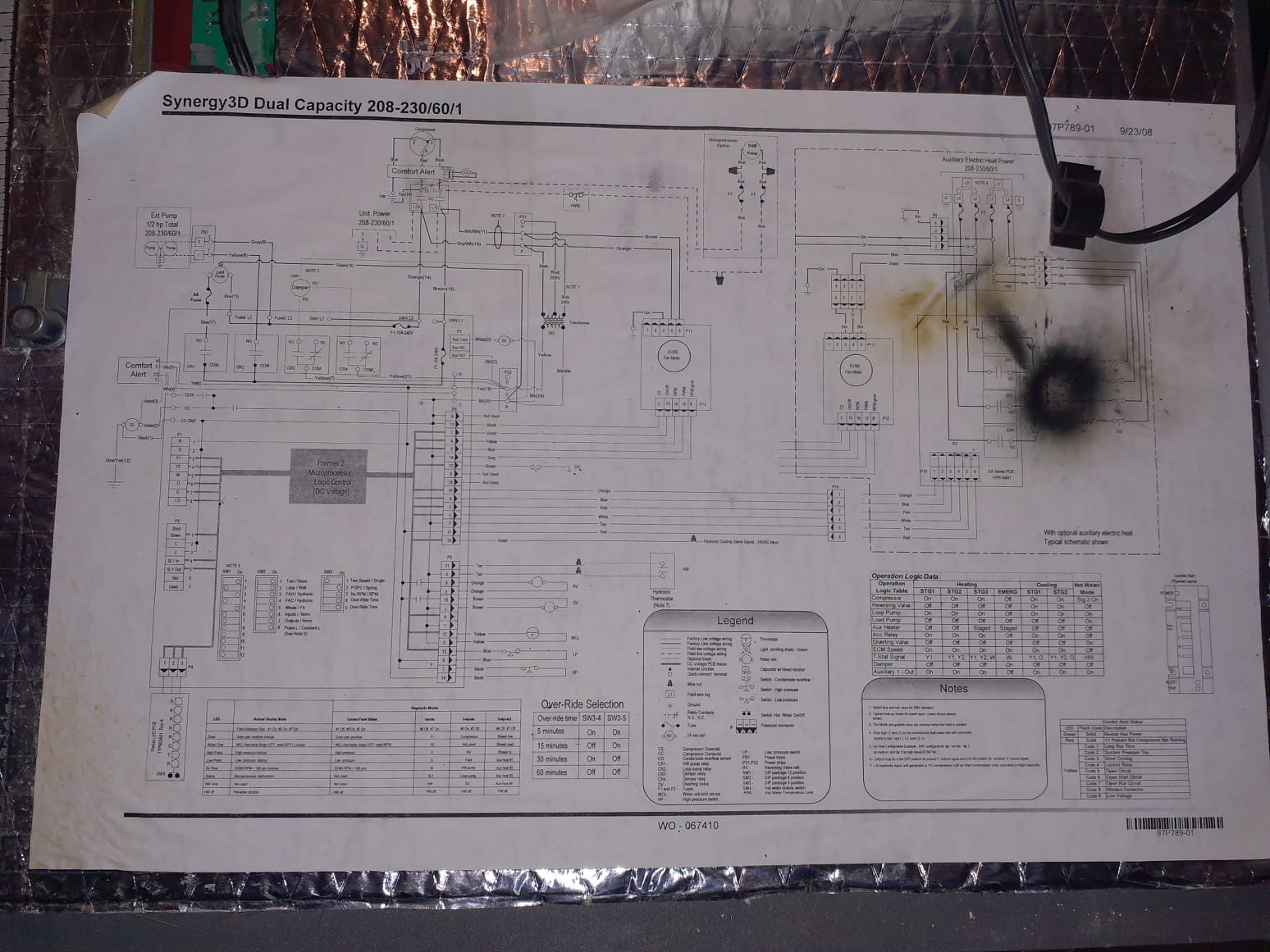 Upon arrival inspected geo and found power supply for the lower cabinet was coming from the heat strip compartment. Compressor capacitor was tested low at 37mfd on the 80 capacitor. Wiring suspected to have overheated and melted due to improper connections for compressor cabinet and compressor overamping to start. Informed homeowner he should have an electrician come out and wire up 240v to the compressor cabinet. Unit was not able to be repaired due to risk of problem reoccurring if wired back up the way it originally was.  