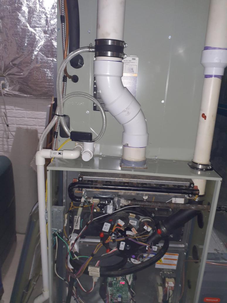 Replace current OEM inducer motor with new OEM inducer motor. Current motor has an extensive amount of water damage and rust. Test run heating operation to verify proper operation of new inducer motor.

Install intake drain trap to prevent water damage to internal components of the furnace. 