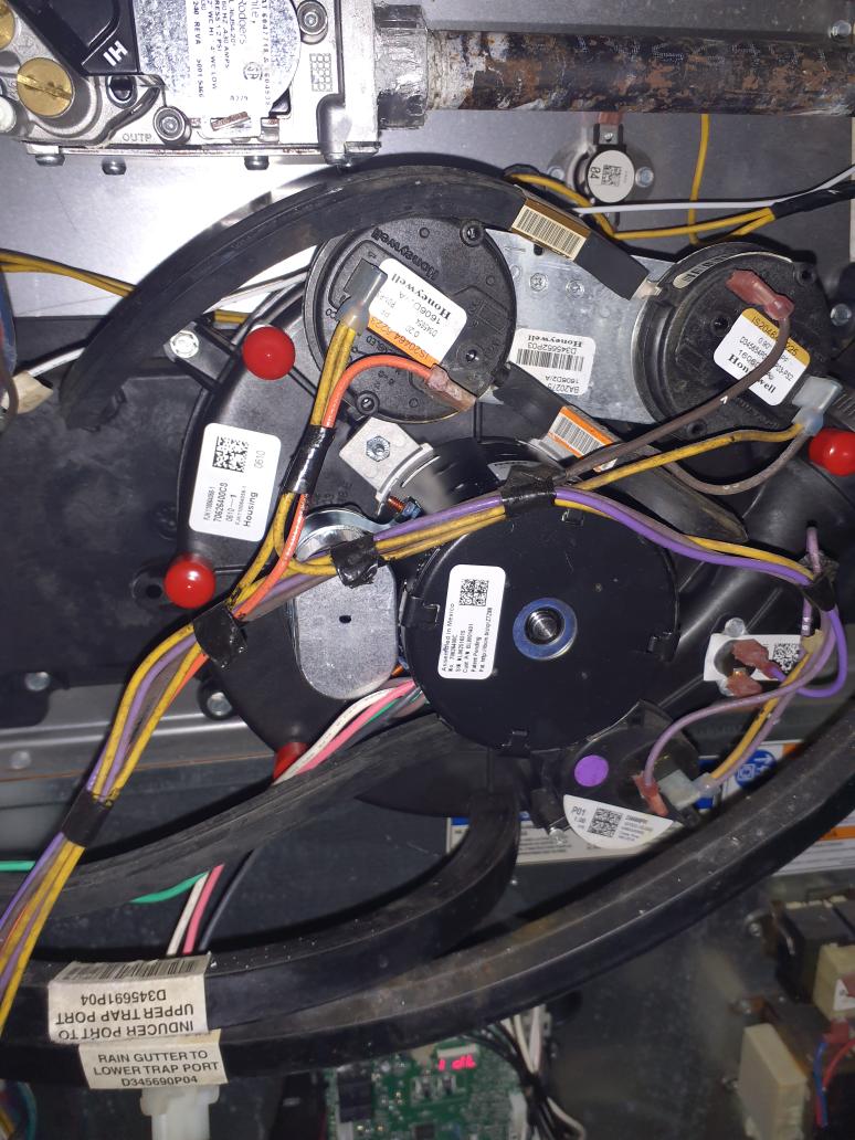 Replace current OEM inducer motor with new OEM inducer motor. Current motor has an extensive amount of water damage and rust. Test run heating operation to verify proper operation of new inducer motor.

Install intake drain trap to prevent water damage to internal components of the furnace. 
