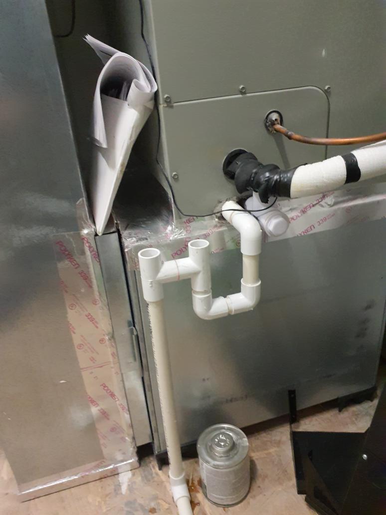 System operates in cooling but not heating mode
Checked refrigerant charge in cooling mode
System calls for 8⁰ subcool +/-3⁰
System was running 0.5⁰ subcool
Added 2lbs of R410a refrigerant 
Run tested in heat mode
Suction pressure fell to the point of opening the low pressure switch. 
Found sensing bulb for the outdoor txv not attached to the suction line
Secured it with a hose clamp and insulated 
It would intermittently drop suction pressure in heating mode as if the txv was restricted or closing 
Switched between heating and cooling modes on the chance there was something clogging the txv that could be knocked loose and trapped in the filter drier
After switching between heating and cooling modes twice, it began to behave normally
Ran it in heating mode for at least 30 minutes
Switched between cooling and heating modes (allowing for system to stabilize in each mode ~10 minutes) to verify proper operation

Air handler condensate did not have a trap 
Built a P trap 
This will mitigate