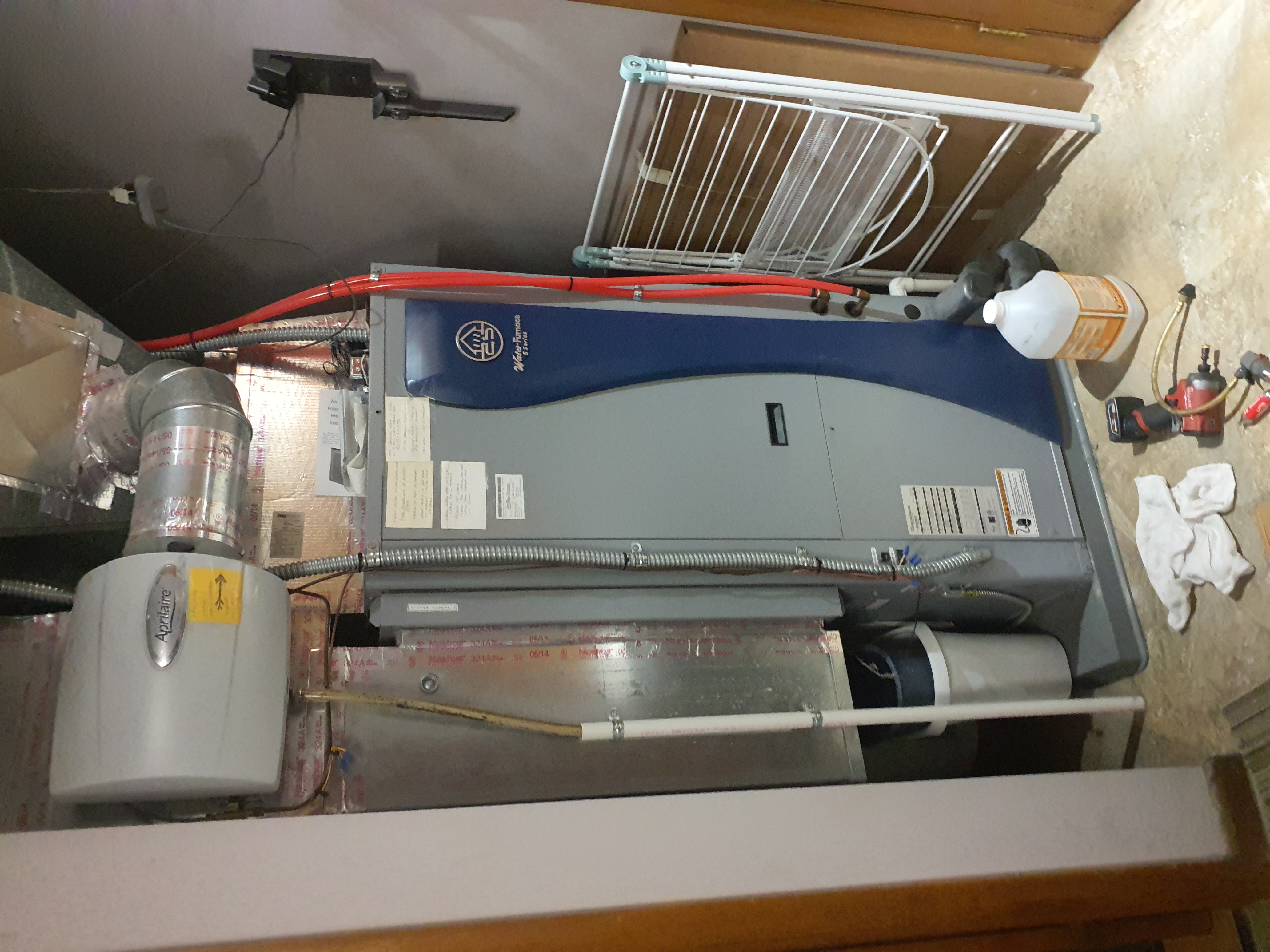 2014 WaterFurnace 5 series package geo.  Last lockout was for blocked condensate.  9 occurances in the error history.  Poured coil cleaner in the drain and let it sit.  Drain is almost 100% clogged.  Tried flushing with hot water.  Drain still wouldn't flow.  Blew out drain line with CO2 gun while pouring hot water.  Drain trap tubing is clear now.  Water now drains almost as fast as it can be poured into the pan.  Advised to pour 2 cups of white vinegar in the drain pan when switching to heat so the trap won't have a chance to allow growth to occur.  Also advised pouring 2 cups of vinegar in the pan once a month during cooling season. Cleared fault history.  System operating normally at this time. 