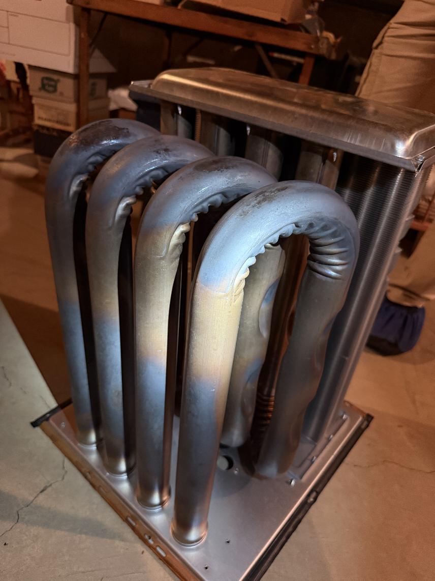 Upon arrival inspected system, found unit erroring out on E3.2 and E3.4 No concerns with main vent pipe nor intake. Upon further inspection, discovered that the combustion was not internally venting properly. Completely disassembled and pulled heat exchanger, After removing heat exchanger discovered, the secondary was full of debris and crumbs from primary breakdown. Quoted full warranty heat exchanger replacement. And recommend replacement. 