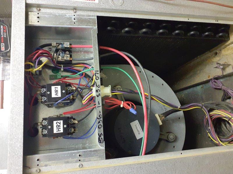 Performed seasonal maintenance on the geothermal heat pump air handler in preparation for winter operation. Inspected the cabinet interior, including the blower assembly, evaporator coil, electric heat contactors (HR1/HR2), and low-voltage wiring, and found no signs of frost, rust, or cracks. Verified condensate drain and loop piping connections and checked the air filter and ductwork condition, with the unit operating properly.