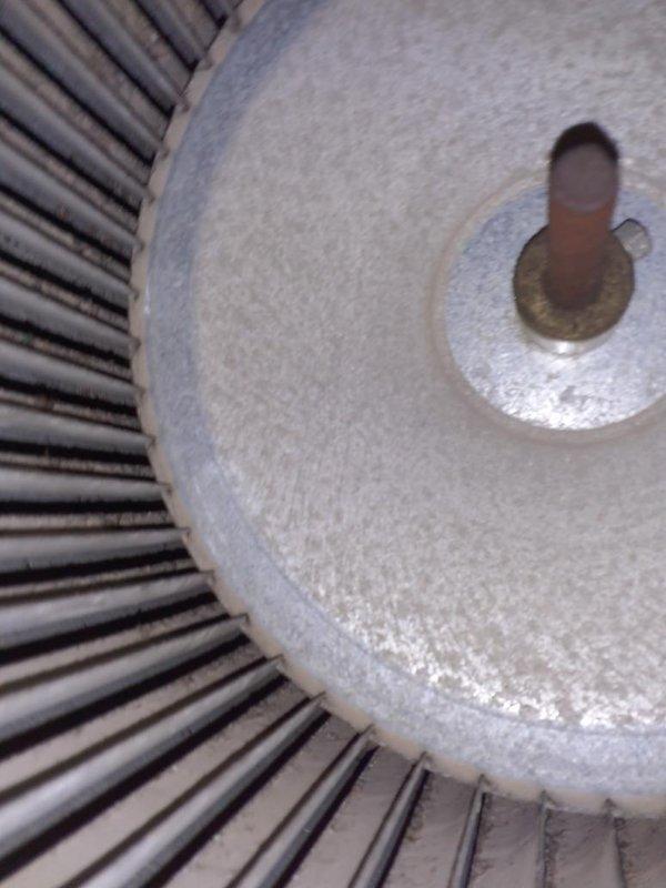 Performed preventive maintenance inspection on one upright gas furnace during a first-time visit; cabinet exterior was clean and intact with no signs of rust, frost, or damage. Inspected the blower assembly and noted heavy dust and grime buildup on the blower wheel blades and hub plate, along with surface rust on the motor shaft, and recommended cleaning and continued monitoring of shaft condition. Customer enrolled in the maintenance plan with 16x25x1 filter size on file and requested a quote for a whole-home humidifier installation.