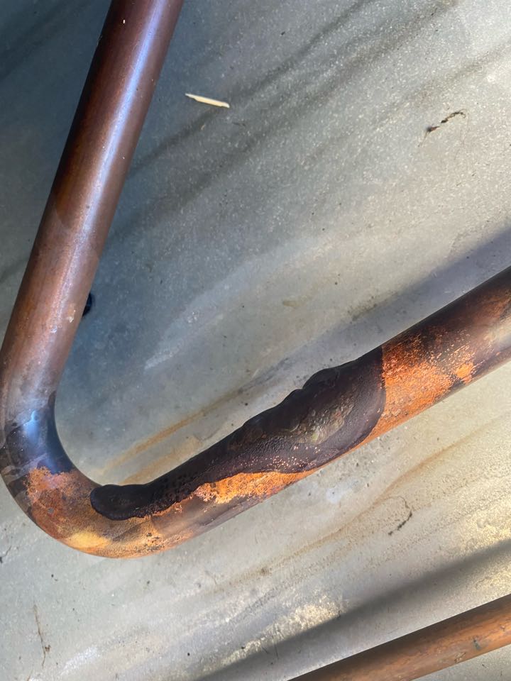 Found and repaired refrigerant leaking on suction line. Wires were rubbing on copper causing it to cut though and make a hole. Pressure tested system, vacuumed down system, then recharged with 4.5lbs of refrigerant. Checked system operations and temperature split. Everything checked out, system now cooling and operational at this time. Serviced unit in Corning CA 