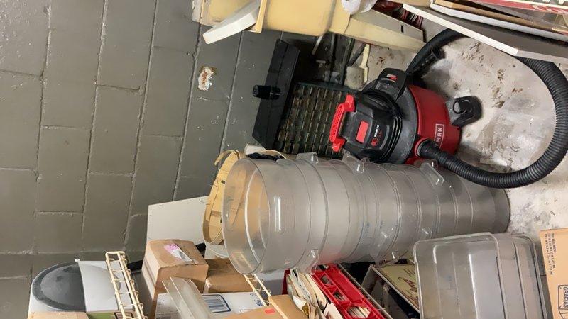 Performed HVAC ductwork maintenance and cleaning service at residential property. Addressed deteriorated outdoor pavement surface showing significant weathering and discoloration, documented existing conditions. Completed interior work involving flexible metallic ductwork installation or replacement, utilizing wet/dry vacuum for debris removal and workspace cleanup. Serviced ventilation system components including duct registers and associated hardware to ensure proper airflow and system functionality.