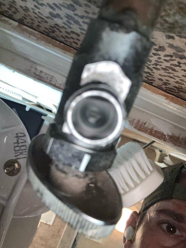 Installed and positioned security camera system with dome-style camera unit mounted to ceiling structure. Verified proper lens alignment and ensured secure mounting of device to perforated ceiling panel with appropriate hardware and bracket assembly.