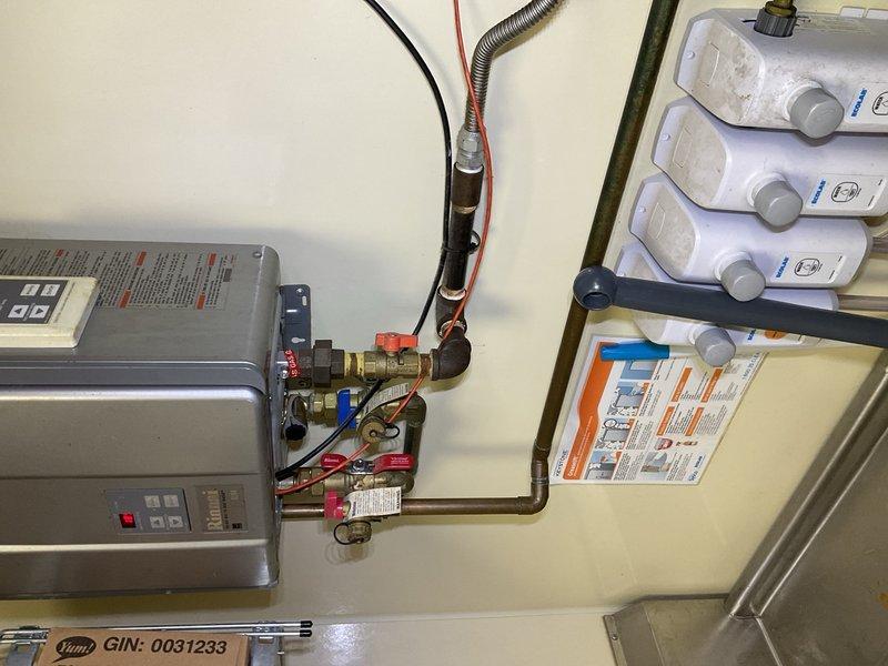 Plumber performed tankless maintenance