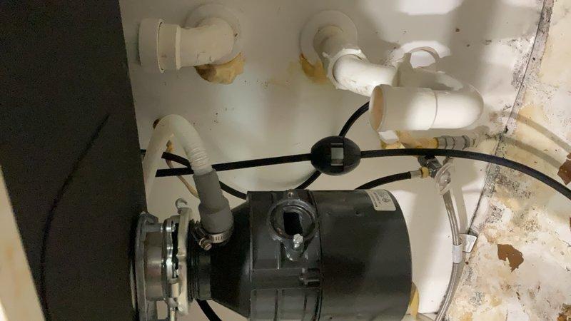 Plumber repaired jammed garbage disposal