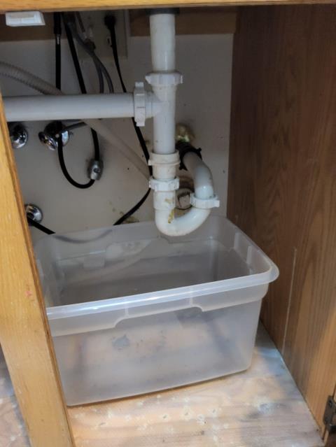 La Conner, WA - Lekaing kitchen sink with a clogged drain repair. Auger and repipe in progress. 