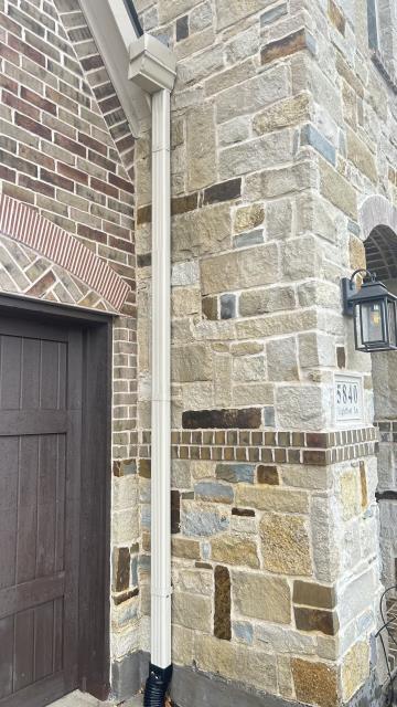 Frisco, TX - This home in Phillips Creek Ranch got brick and algae cleaning behind the gutter. Mildew and algae removal goodbye, we just boosted curb appeal in Frisco, TX call your local Window Hero pressure washing, softwashing, adn house washing. 