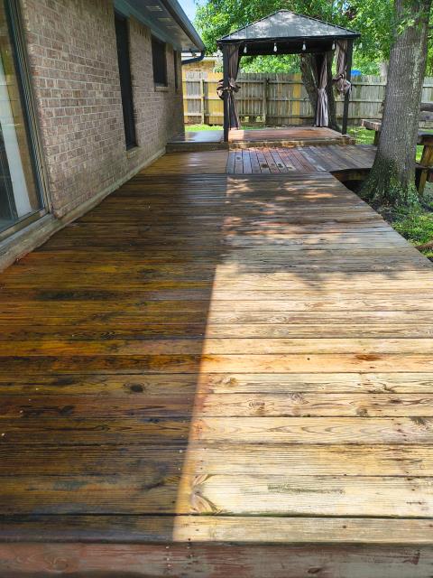 College Station, TX - We pressure washed the back deck area of a house as well as cleaned the windows on the home in the back near the deck.