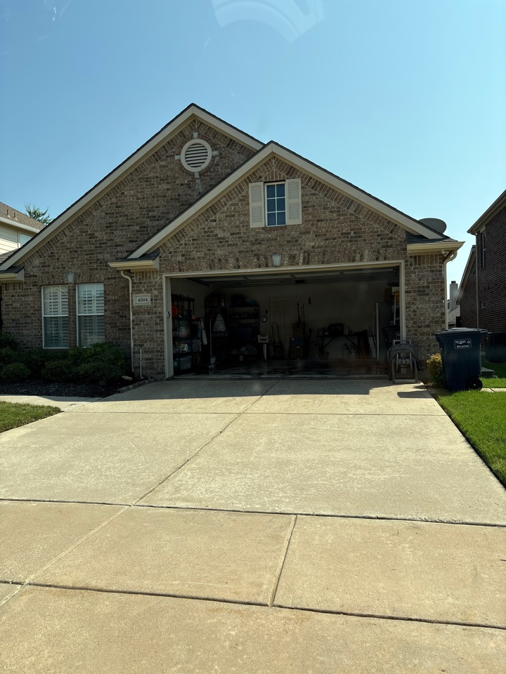 Fort Worth, TX - Just finished pressure washing this driveway! We removed built up dirt, oil stains, and grime restoring curb appeal and making it shine!