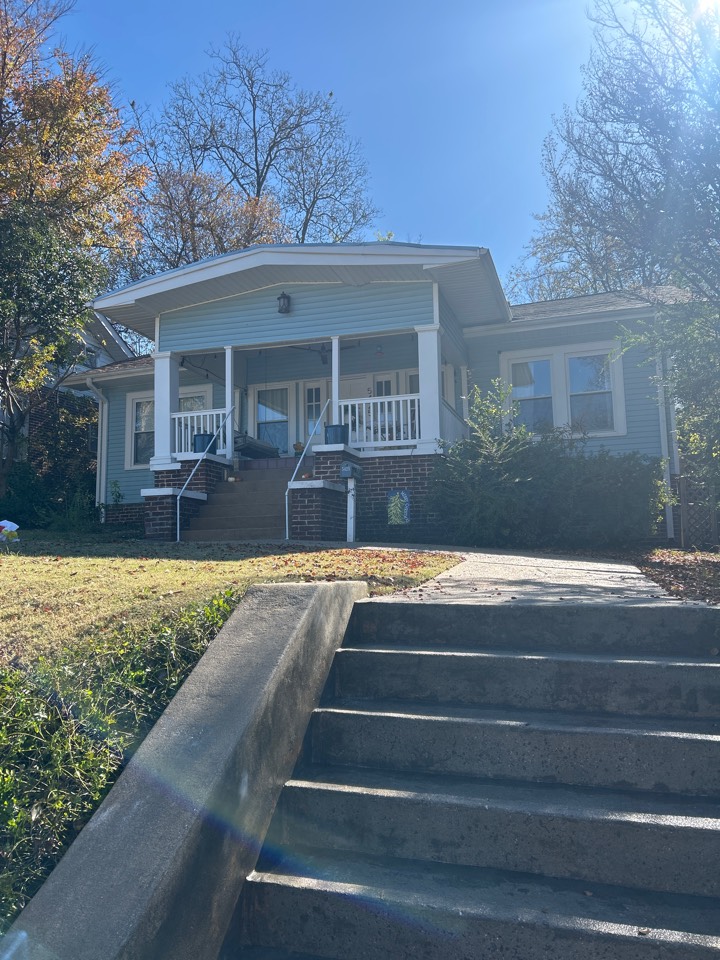Birmingham, AL - Did gutters a house wash house wash on the shed, walkways front, stoop and retaining wall pressure washing here and exterior windows