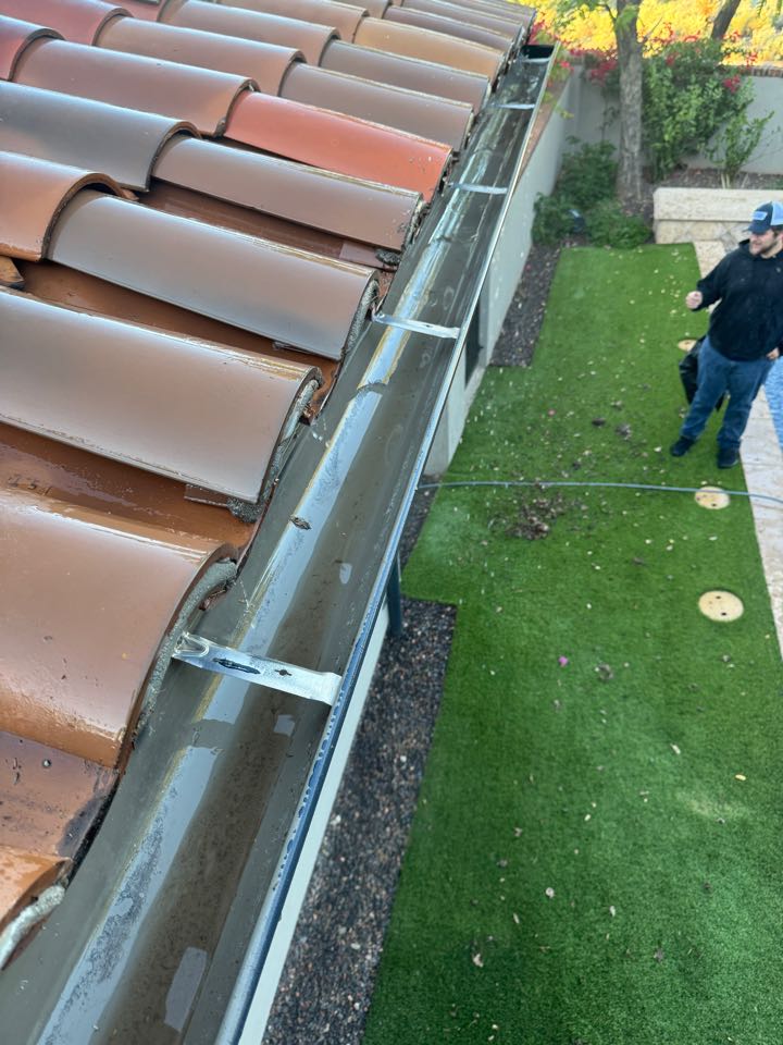 Scottsdale, AZ - Gutter cleaning is often overlooked but can cost tens of thousands to fix when water gets in your house today. Silverleaf Wind Gate Scottsdale 