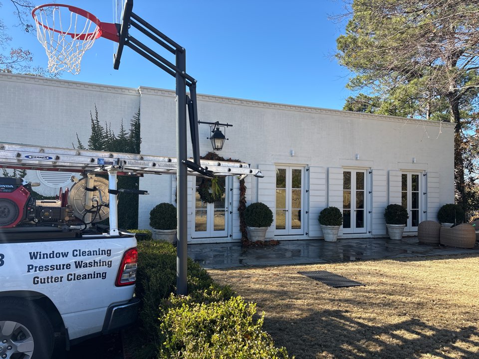 Birmingham, AL - Mountain Brook, AL doing an exterior window cleaning following a soft washing of the sills and frames to create a nice clean streak free finish.