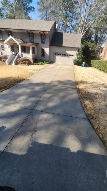Atlanta, GA - Doing a pressure wash for a driveway and front steps for a customer in Dunwoody. Removed a lot of grime and white spots