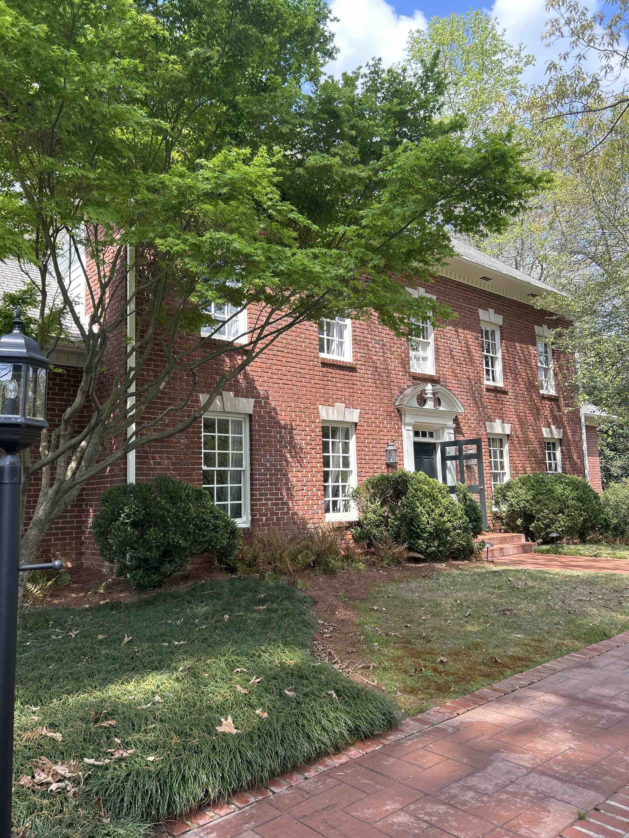 Birmingham, AL - Did exterior windows here with a soft washing upper brick porch as well as lower brick porch and the front patio walkway section and blew off the garage section of the roof
