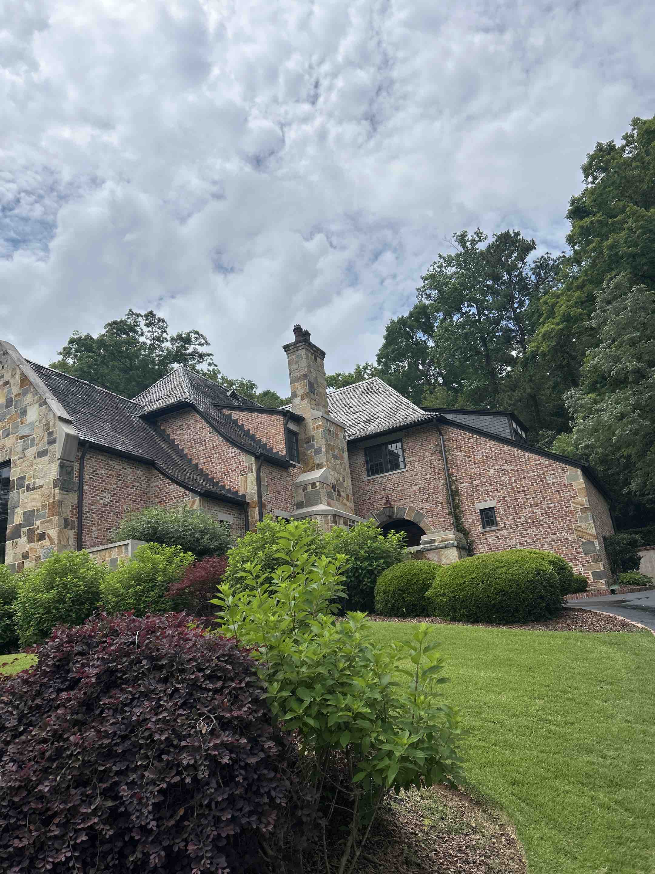 Birmingham, AL - Did back patio pressure washing with flagstone steps and gutter leaf removal as well as retaining walls and select exterior windows here