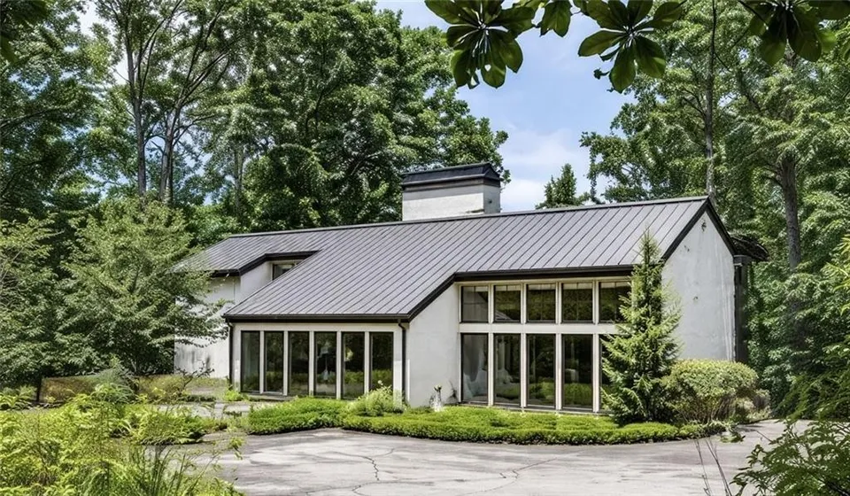 Atlanta, GA - We tackled a major exterior project, cleaning all windows inside and out. The metal roof was meticulously cleaned, and the exterior received a thorough soft wash. Gutters were also cleaned, ensuring a sparkling finish.