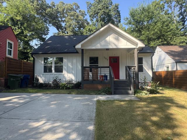 Atlanta, GA - We completed a thorough exterior house wash, driveway pressure wash, and soft wash for the front porch and back wooden deck.