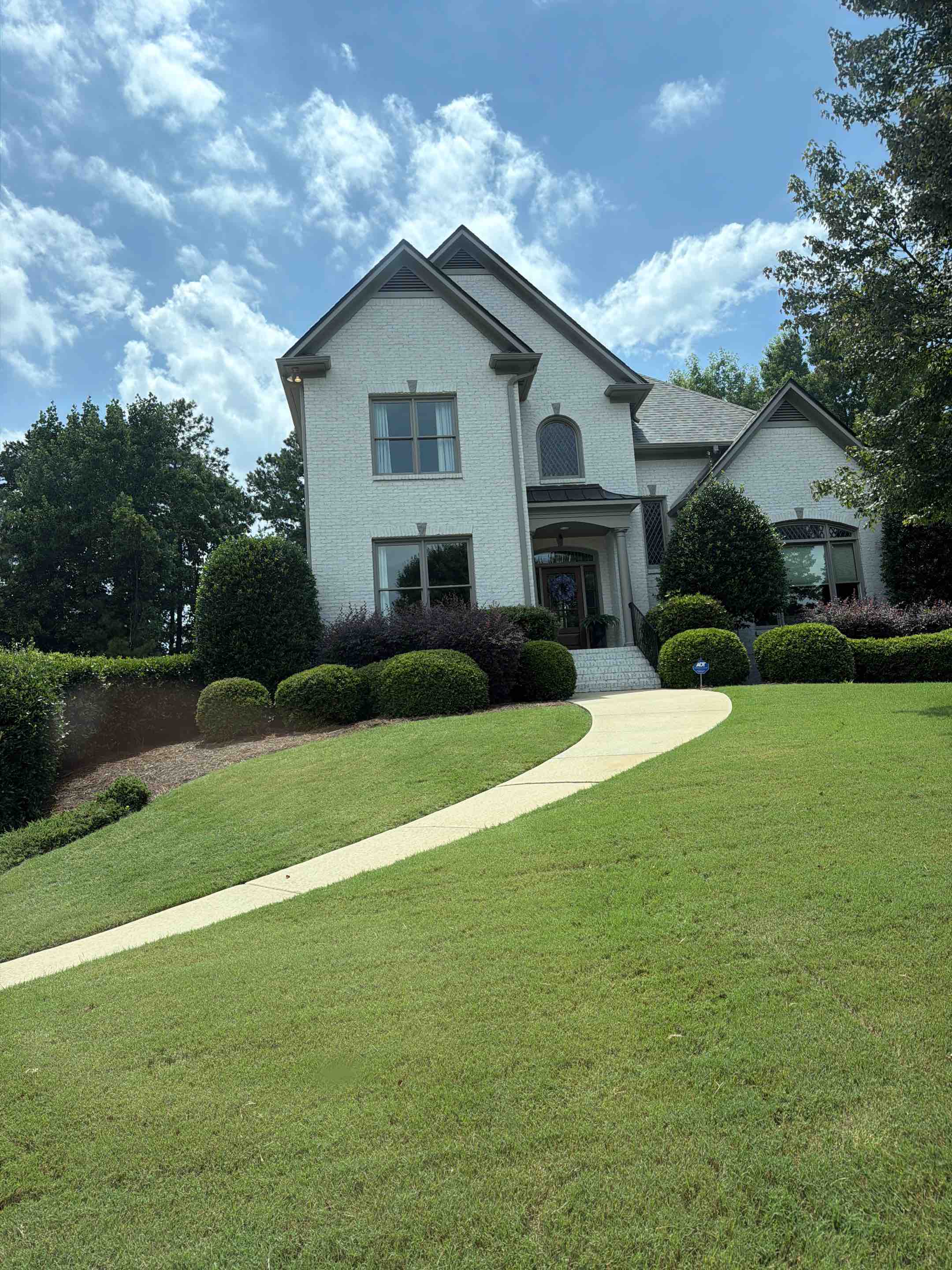 Birmingham, AL - Did driveway pressure wash to remove dirt and  grime. Changed out some floodlights and did an exterior window clean for a crystal clear look