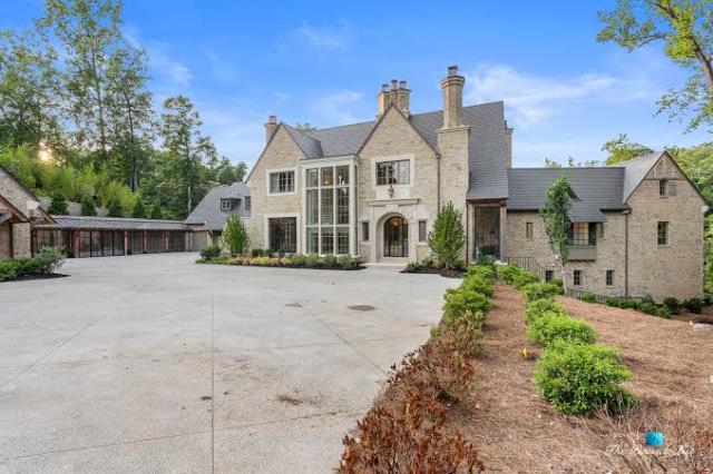Atlanta, GA - We meticulously cleaned and cleared the gutters of this large 15,000 square foot property, ensuring they were free of debris and ready for the rainy season.