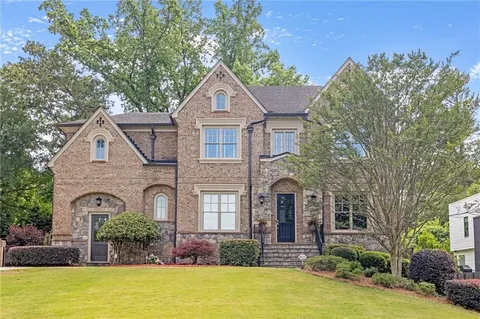 Atlanta, GA - We meticulously cleaned all exterior windows, performed a thorough roof wash, and applied an exterior soft wash to the home's exterior, ensuring a sparkling clean finish.