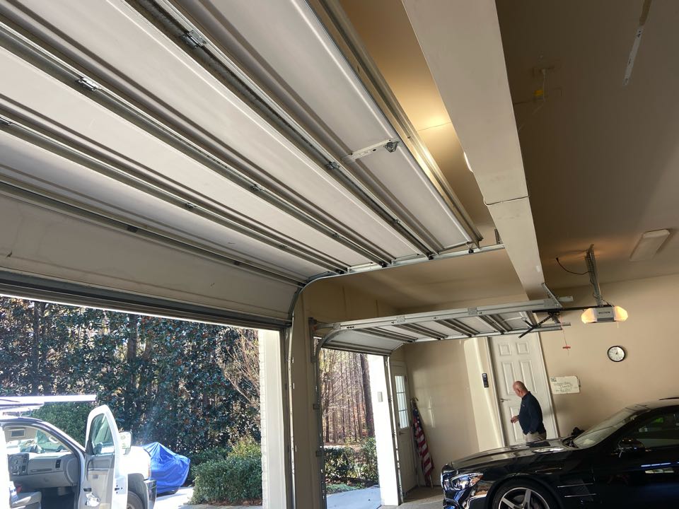 Installed a High-Lift kit and a side mount Liftmaster jackshaft motor for a single two car insulated garage door. 