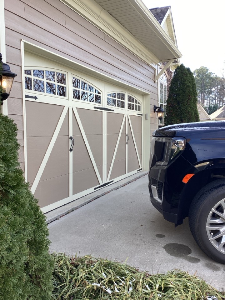 Replaced a pair of broken torsion springs on a single two car metal garage door.