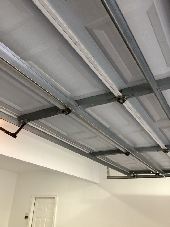 Added a strut for reinforcement of a garage door section.