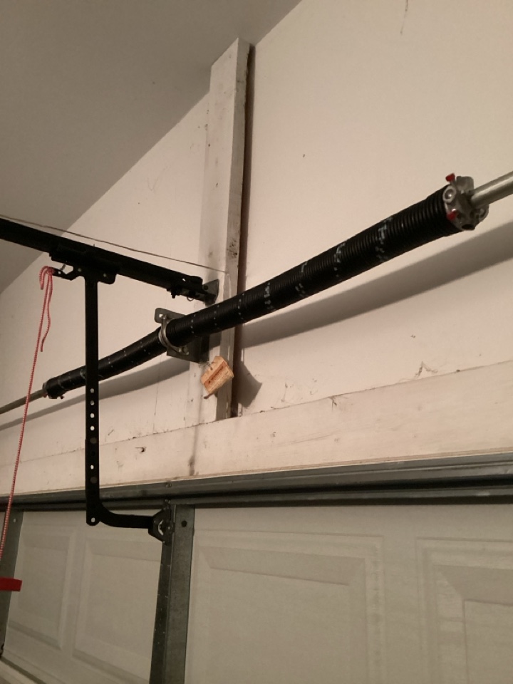 Replaced broken torsion springs on a single two car metal garage door.